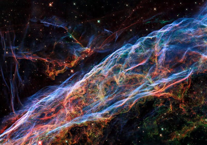 Veil Nebula supernova remnant in Cygnus — Hubble WFC3 image 2021 showing blue ionised oxygen filaments and red hydrogen and nitrogen threads across 110 light-years