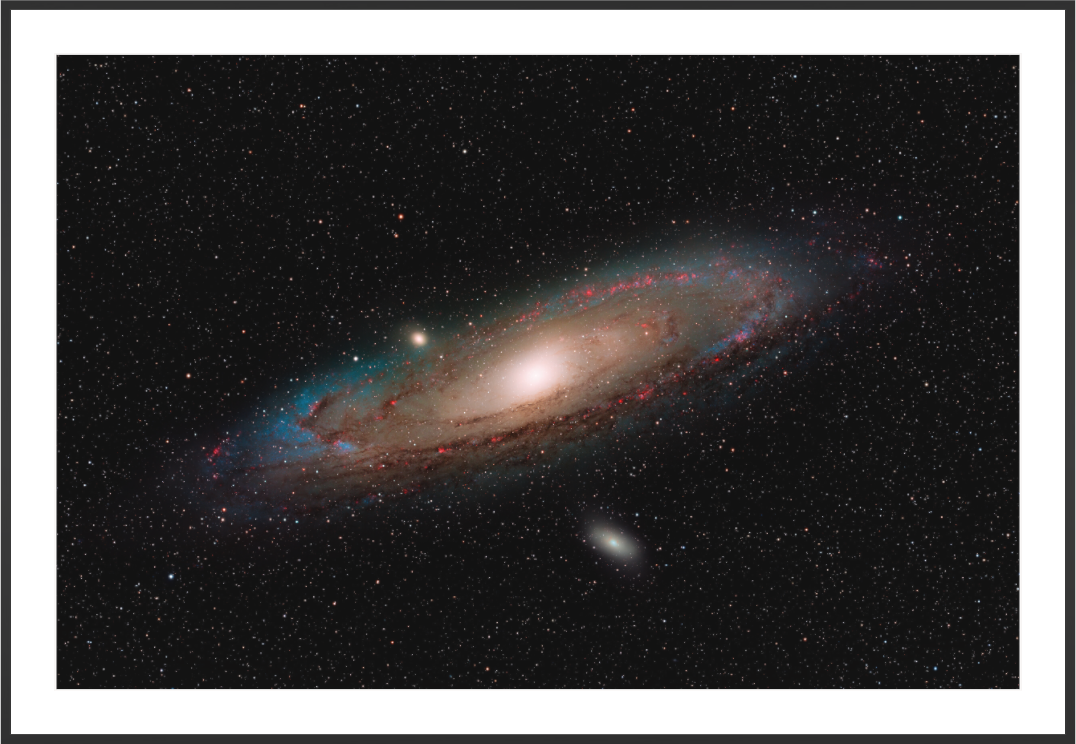 M31 Andromeda Galaxy with hydrogen alpha enhancement, fine art astrophotography print with Black Frame by Sideris Art, photographed from the Colli Euganei, Italy